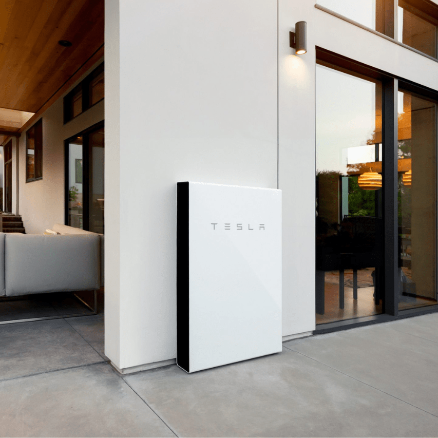 Tesla Powerwall home battery storage system installed in residential garage for solar energy backup